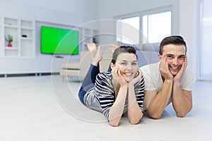 Couple lying on the floor at home