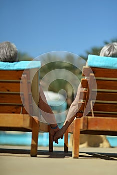 Couple lying by pool