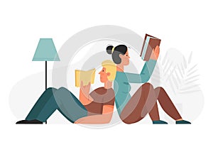 Couple lying and reading book at cozy home