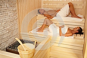 Couple lying in sauna