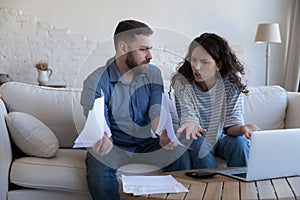 Couple making budget analysis feel stressed due to money overspend