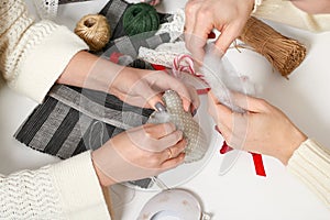 Couple making decorations for Valentine`s day, recover damaged heart, top view - romantic and love concept