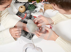 Couple making decorations for Valentine`s day, recover damaged heart, top view - romantic and love concept