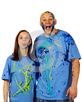 Couple making faces at the camera after a paint wa