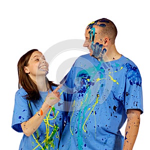 Couple making faces at the camera after a paint wa