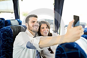 Couple Making Memories During Bus Travel