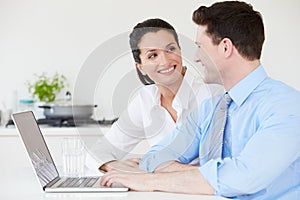 Couple Making Online Purchase At Home