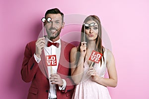 Couple making photos in photobooth