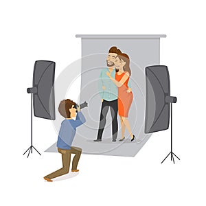 Couple making photoshooting with professional photographer in studio