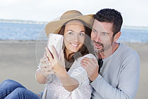 couple making selfie on beach