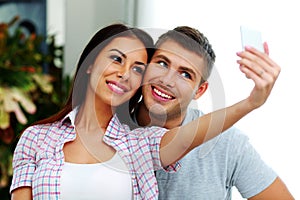 Couple making selfie photo with smarphone