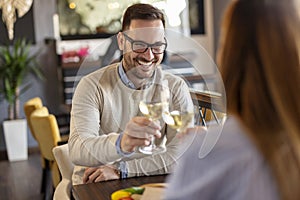 Couple making a toast with glasses of wine