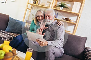 Couple making video call on digital tablet at home.Quarantine. Health concept