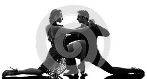 Couple man woman ballroom dancers tangoing silhouette