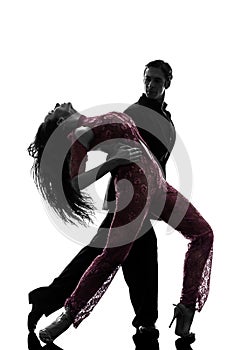 Couple man woman ballroom dancers tangoing silhouette