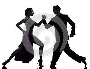 Couple man woman ballroom dancers tangoing silhouette