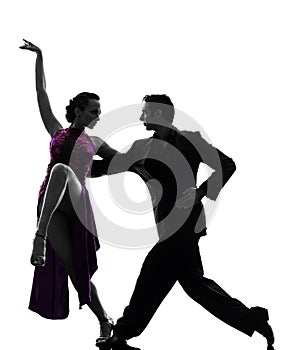 Couple man woman ballroom dancers tangoing silhouette