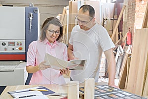 Couple man and woman choosing wooden products, working discussion