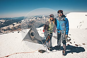 Couple Man and Woman climbing reached Elbrus mountain