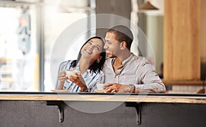 Couple, man and woman at coffee shop love drinking tea on their romantic, happy and relaxed cafe date together. Young