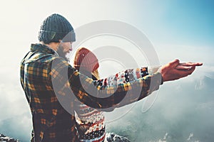 Couple Man and Woman holding hands raised together