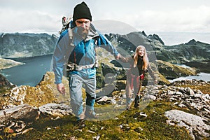 Couple man and woman holding hands travelers hiking