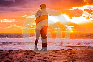 Couple Man and Woman Hugging in Love staying on Beach seaside