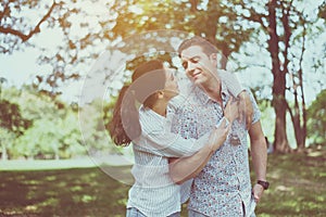 Couple man and woman in love hugging each other at park,Romantic and enjoying in moment of happiness time,Happy and smiling