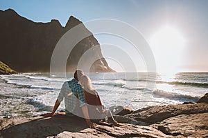 Couple man and woman in love relaxing on Kvalvika beach