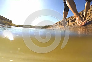 Couple man and woman running on the water wave