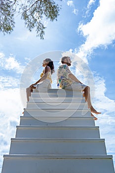 couple man and woman on stairway in the sky, Ladder Way to Heaven isolated on sky
