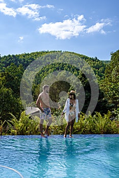 couple man and woman at a swimming pool during vacation in South Africa