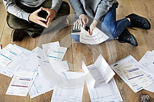 Couple managing the debt by calculating