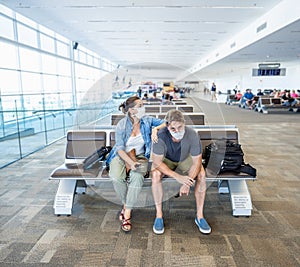 Couple with mask stuck in airport no able to return home country due to COVID-19 border closures