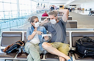 Couple with mask stuck in airport no able to return home country due to COVID-19 border closures