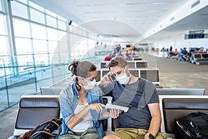 Couple with mask stuck in airport no able to return home country due to COVID-19 border closures
