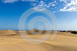 Couple on Maspalomas dunes Sahara sand