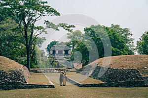 couple in Mayan ruins in Palenque, Chiapas, Mexico.