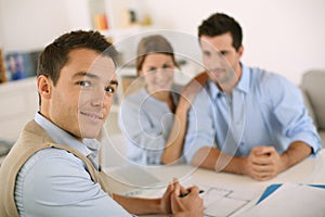 Couple meeting architect in office