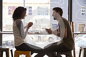 Couple Meeting For Date In Coffee Shop