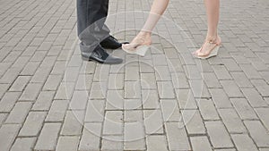 Couple meeting on a date, male and female legs close up