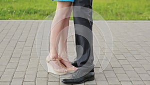Couple meeting on a date, male and female legs close up