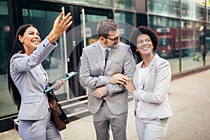 Couple meeting real-estate agent outside new property