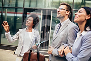 Couple meeting real-estate agent outside new property