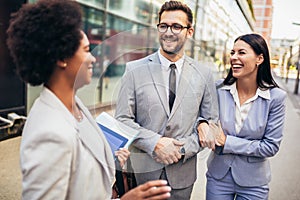 Couple meeting real estate agent outside new property