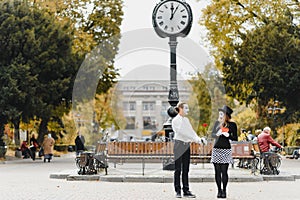 A couple of merry mimes. He hurries on a date