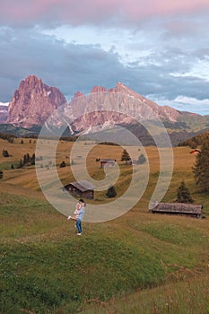 Couple mid age men and woman visiting the Italian Dolomites in Italy Alpe di Susi, Seiser alm