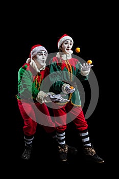 Couple of mimes in New Year costumes isolated