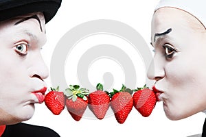 Couple of mimes with the strawberry on a white ba
