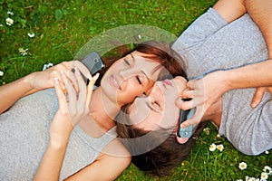 Couple with mobile phones outdoor